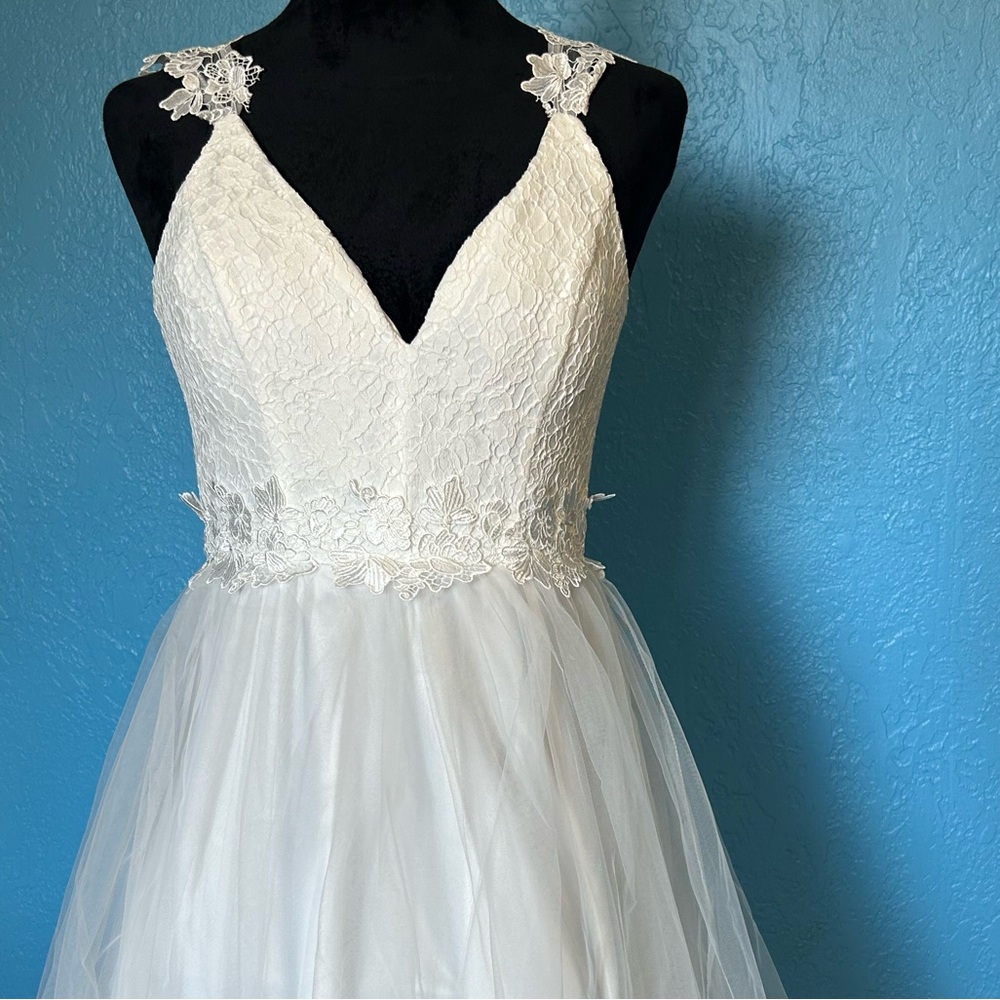 White gown for prom or formal wear.